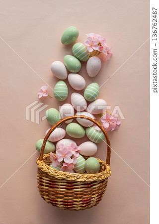 Easter Basket with Pastel Eggs, Flowers and Bunny Decorations. Festive Spring Flatlay Easter Basket with Pastel Eggs, Flowers and Bunny Decorations. Festive Spring Flatlay 136762487