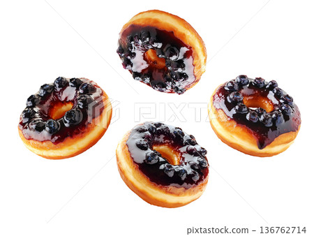 Multiple blueberry glazed donuts with shiny icing and berries scattered in a seamless pattern on white background Multiple blueberry glazed donuts with shiny icing and berries scattered in a seamless pattern on white background 136762714