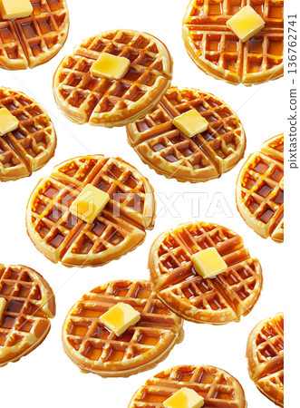 Delicious golden waffles topped with butter and syrup isolated on a white background. Concept of breakfast food 136762741