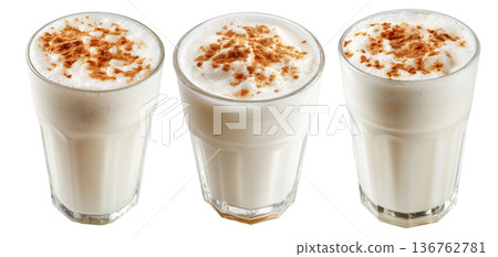 Ayran salted yogurt drink in tall glass with foamy top and cinnamon powder, isolated on white background, concept of healthy drink 136762781