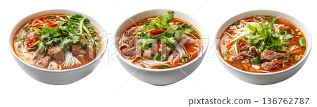 Vietnamese beef noodle soup Bun Bo Hue with herbs, lime slice, and rice noodles in broth isolated on white background Vietnamese beef noodle soup Bun Bo Hue with herbs, lime slice, and rice noodles in broth isolated on white background 136762787