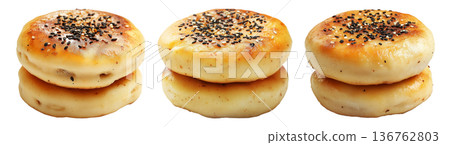 Stack of golden brown fluffy Korean Hotteok pancakes lightly dusted with powdered sugar, isolated on white background 136762803