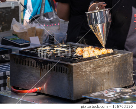 Japanese food with takoyaki, ebiyaki, chizuyaki. Chefs cooking Japanese street food, editorial image Japanese food with takoyaki, ebiyaki, chizuyaki. Chefs cooking Japanese street food, editorial image 136763150