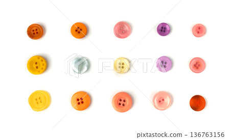 Multicolored sewing buttons isolated. Plastic sew buttons of different colors and sizes Multicolored sewing buttons isolated. Plastic sew buttons of different colors and sizes 136763156