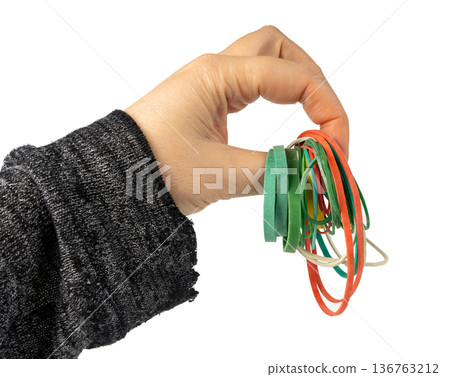 Rubber band isolated. Elastic rubberband bracelets pile, plastic flexibility circles Rubber band isolated. Elastic rubberband bracelets pile, plastic flexibility circles 136763212