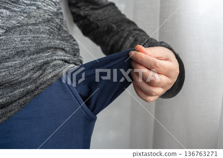 Empty pockets close-up. Person is showing financial loss, no money, poor person 136763271