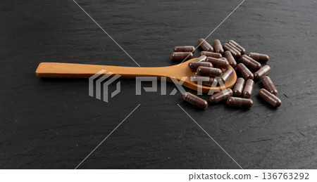 Iron capsule, Fe pills, dark red hemoglobin supplement tablets, vitamin capsules, mineral Iron capsule, Fe pills, dark red hemoglobin supplement tablets, vitamin capsules, mineral 136763292