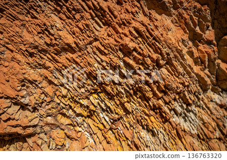 Panoramic view of red and yellow mountains with canyons and gorges at Mars Altai Russia. Popular tourist destination showcasing unique colorful geological formations. 136763320