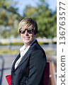 Confident businesswoman portrait outdoors 136763577
