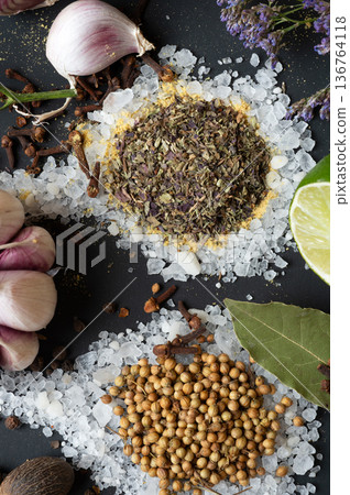 seasonings background with salt, Spices  and garlic served  at black. natural meal additives. healthy food concept. macro shot 136764118