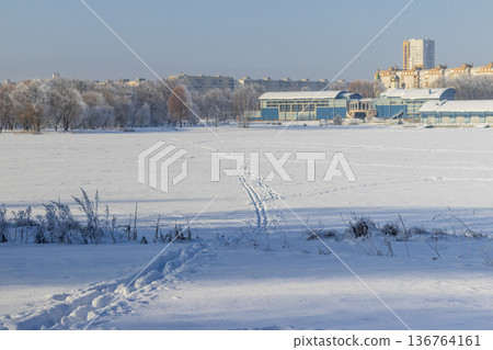 A frozen body of water covered in snow. Season A frozen body of water covered in snow. Season 136764161