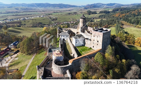 Aerial view of the medieval stone castle Stara Lubovna to the village below. Aerial view of the medieval stone castle Stara Lubovna to the village below. 136764218