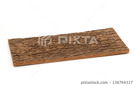 Rectangular piece of natural tree bark with rough texture, isolated on a white background. 136764317