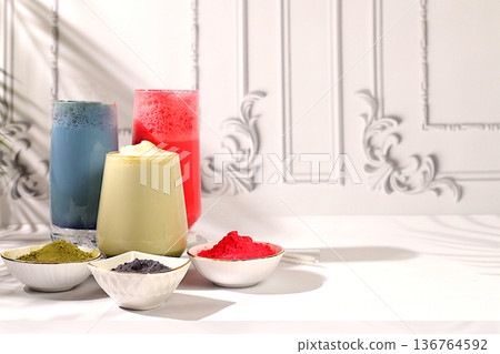 Assortment of various matcha tea latte with milk on elegant kitchen sunny background and matcha powder. Traditional Indian drink rich in antioxidants used for weight loss and treatment, 136764592