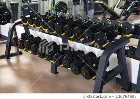 Dumbbells in a fitness center 136764693