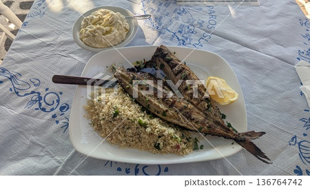 Grilled sun dried fish with couscous and Greek fish roe dip Grilled sun dried fish with couscous and Greek fish roe dip 136764742