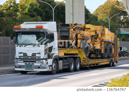 Trailer transporting heavy machinery Trailer transporting heavy machinery 136764767