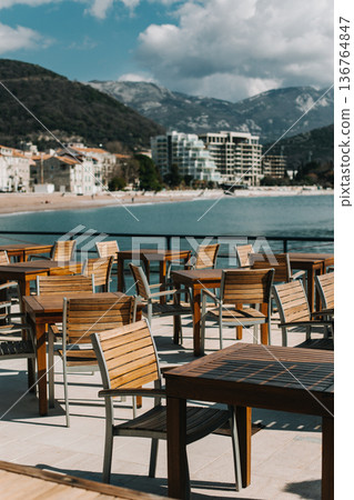 Empty cafe by the sea in Petrovac, Montenegro. Travel destination in Montenegro. Empty cafe by the sea in Petrovac, Montenegro. Travel destination in Montenegro. 136764847