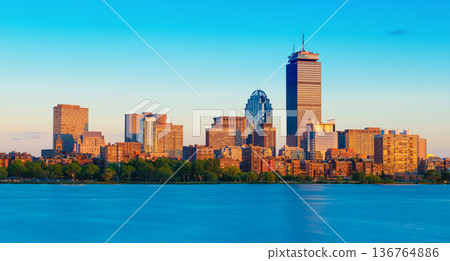 Evening panorama of Boston, cityscape viewed from Cambridge across the Charles River, Massachusetts, USA Evening panorama of Boston, cityscape viewed from Cambridge across the Charles River, Massachusetts, USA 136764886