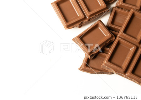 Close-up of a chocolate bar on a white background Close-up of a chocolate bar on a white background 136765115