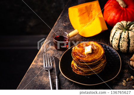 Pumpkin pancakes with maple syrup Pumpkin pancakes with maple syrup 136765627