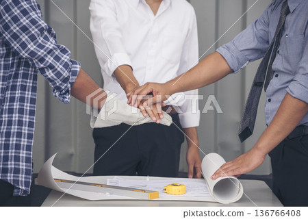 Group of multiracial people Teamwork meeting join hands Engineer Manager Foreman fist bump together. Close up diversity engineer people hands partner teams. Business connection team join partnership 136766408