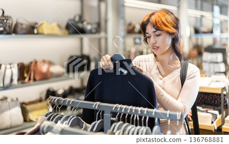 Young woman search and choose jacket Young woman search and choose jacket 136768881