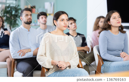 Young people are listening to lecture in auditorium 136769163