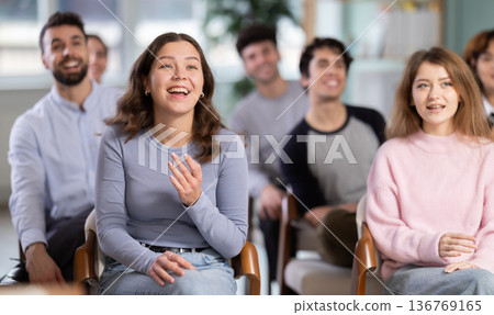 Group of happy students laughing during educational class Group of happy students laughing during educational class 136769165