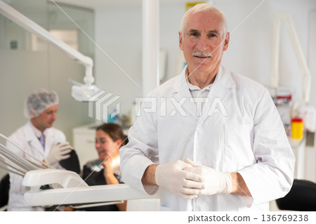 Elderly man doctor in dental office 136769238