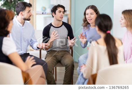 Students sitting in a circle and discussing a lecture Students sitting in a circle and discussing a lecture 136769265