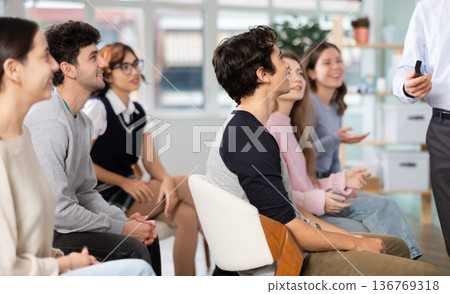 Students laugh during lecture Students laugh during lecture 136769318