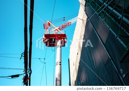 Apartment building construction in the city, tower cranes and power lines a-4 light color Apartment building construction in the city, tower cranes and power lines a-4 light color 136769717