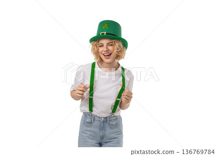 Woman in festive green hat and suspenders smiles, isolated, PNG Woman in festive green hat and suspenders smiles, isolated, PNG 136769784