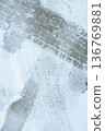 Tire tracks in the snow 136769881