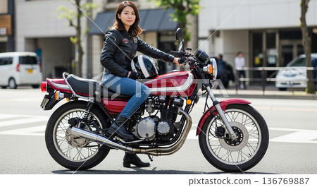 A young woman riding a motorcycle (vintage car) 136769887