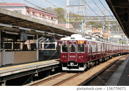 An express train leaving Hankyu Nakayama Kannon Station heading towards Osaka Umeda An express train leaving Hankyu Nakayama Kannon Station heading towards Osaka Umeda 136770071