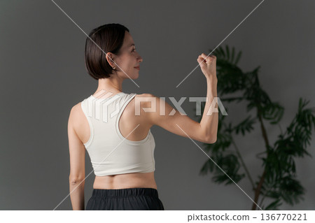 Woman doing muscle training Woman doing muscle training 136770221