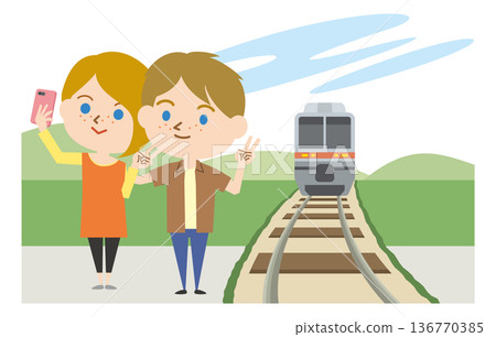 A foreigner taking a selfie in front of a moving train 136770385