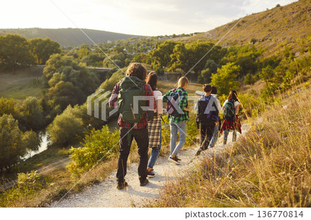 Group Of Tourists Hiking In The Mountains On Vacation 136770814