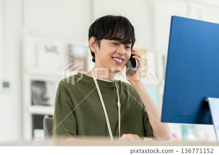 Young male engineer calling in the office 136771152