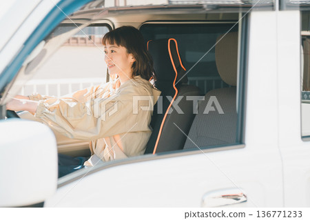 A housewife driving a light van A housewife driving a light van 136771233