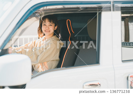 A housewife driving a light van 136771238