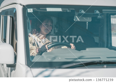 A housewife driving a light van A housewife driving a light van 136771239