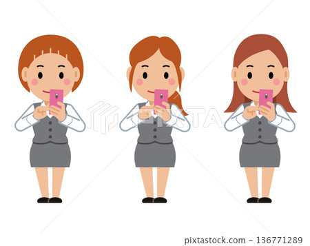 一位身穿灰色職業制服的年輕女子正在操作智慧型手機。第二部分 一位身穿灰色職業制服的年輕女子正在操作智慧型手機。第二部分 136771289