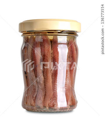 Anchovy fillets in oil in screw-top glass jar. Salted fillets from Peruvian anchoveta, Engraulis ringens, a small saltwater forage fish, with intense umami flavor, rich in omega-3 fatty acids. Photo Anchovy fillets in oil in screw-top glass jar. Salted fillets from Peruvian anchoveta, Engraulis ringens, a small saltwater forage fish, with intense umami flavor, rich in omega-3 fatty acids. Photo 136773554