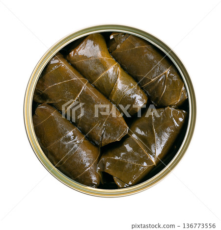Stuffed vine leaves, in  open tin can. A type of dolma, specifically known as sarma. Filled with rice and herbs, cooked and preserved. Known as dolmades in Greece, and yalanci dolma in Turkey. Photo 136773556