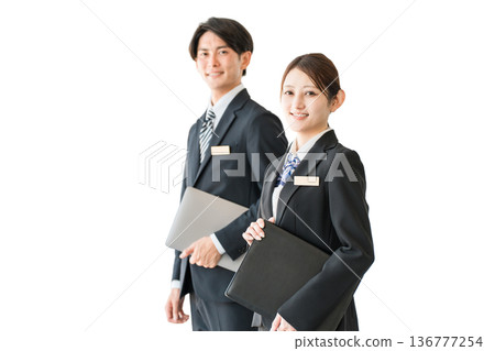 Young male and female Asian business people in suits (planner, advisor, banker, consultant) Young male and female Asian business people in suits (planner, advisor, banker, consultant) 136777254