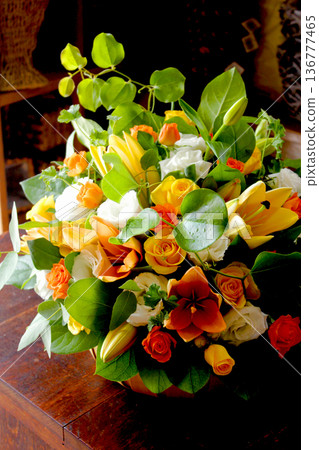 A calming flower arrangement using orange lilies 136777465
