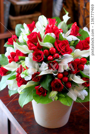 Beautiful flower arrangement made up of red and white flowers Beautiful flower arrangement made up of red and white flowers 136777469
